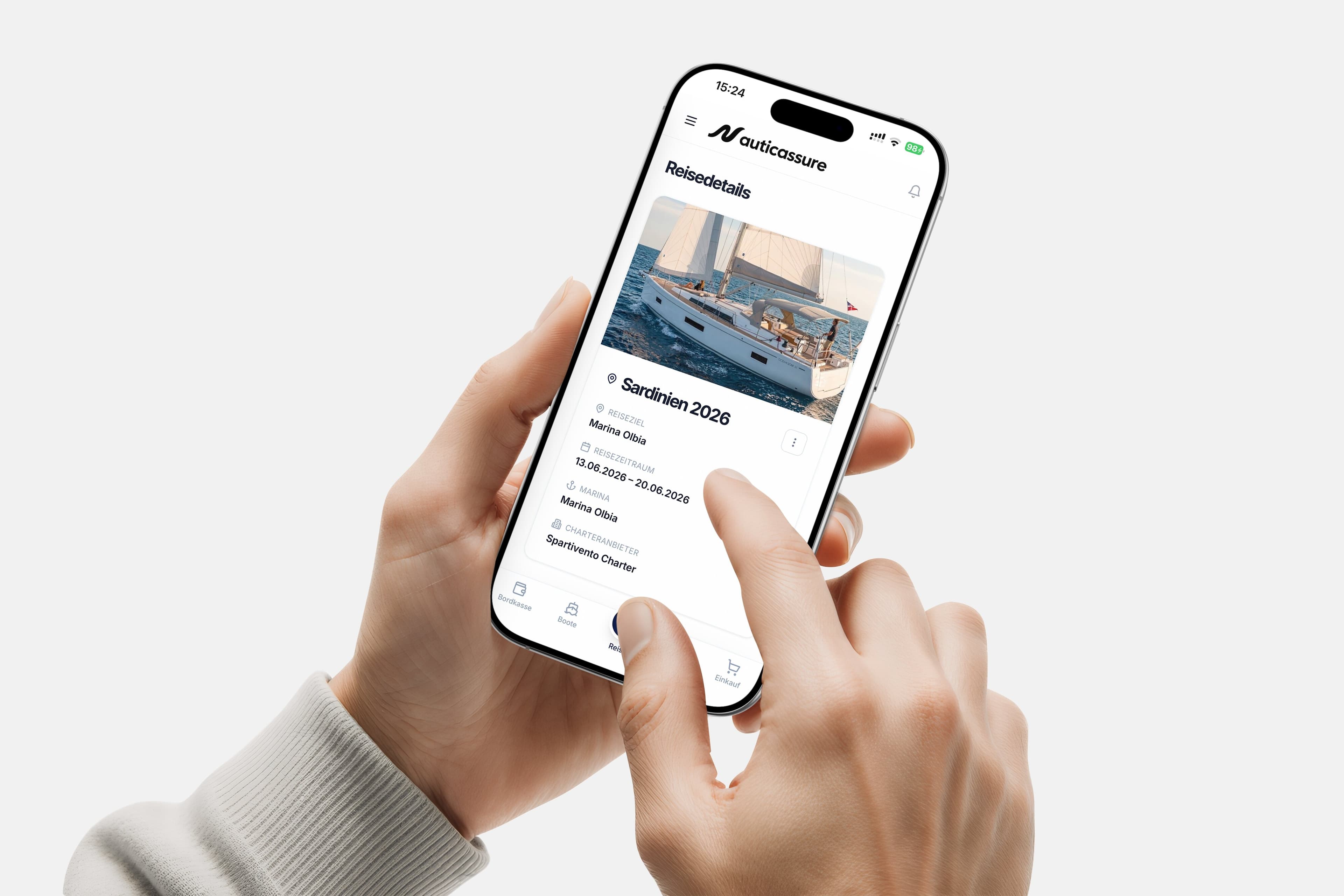 Hands holding a smartphone showing trip details in the NauticAssure app
