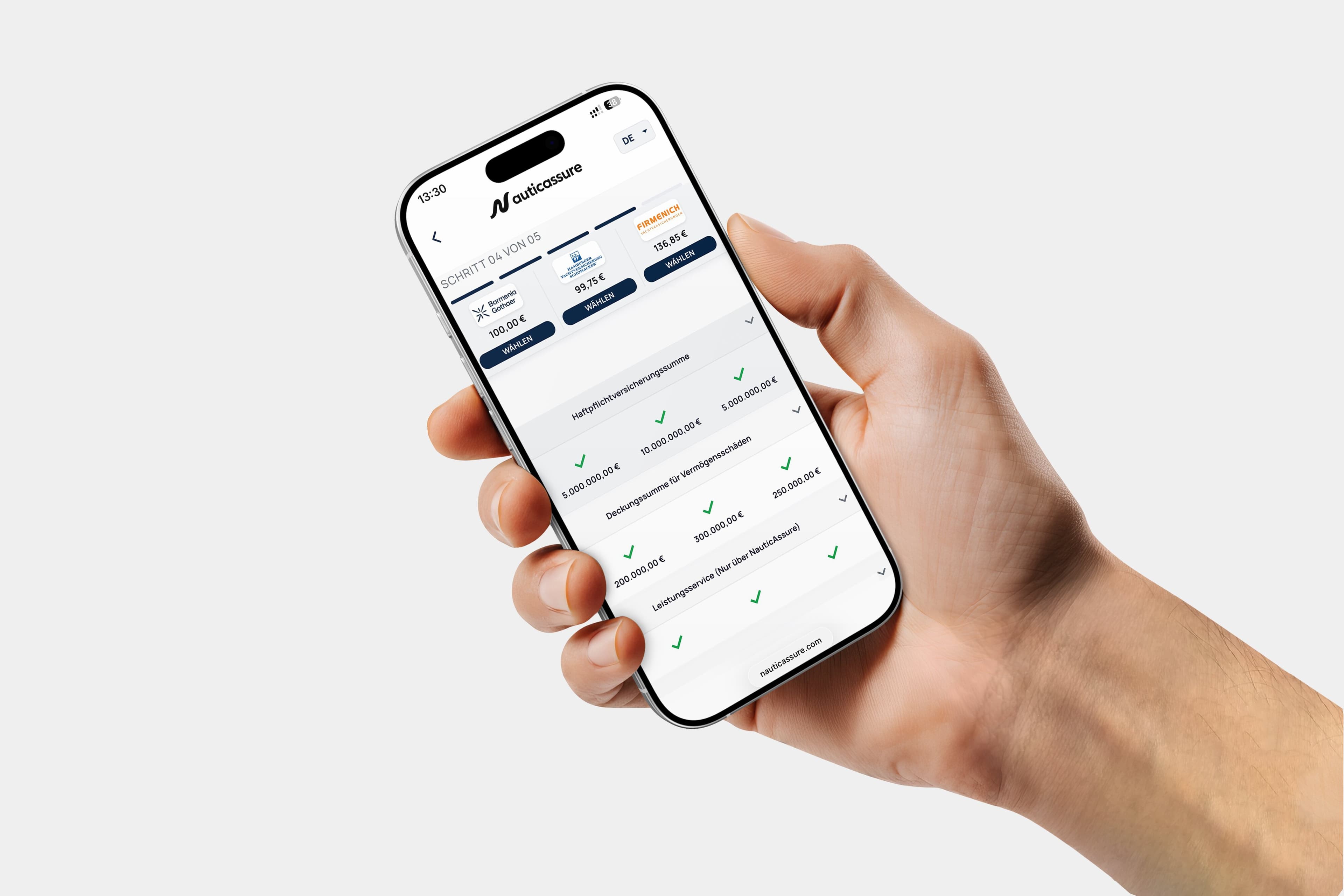 A hand holding a smartphone showing the NauticAssure comparison calculator